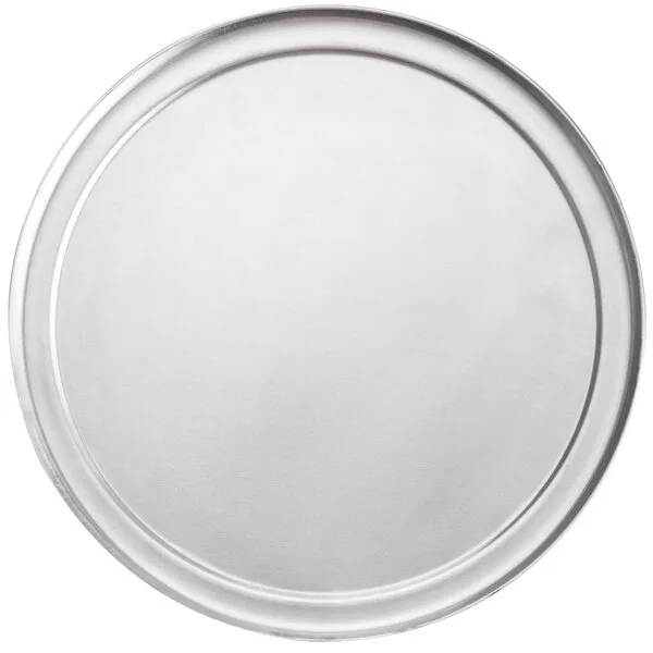 Clear round disposable plastic plate with flat bottom and raised rim, ideal for food service and wholesale food distribution.
