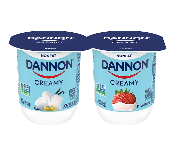 Dannon Creamy Nonfat yogurt cups in vanilla and strawberry flavors for wholesale food distribution and foodservice supply.
