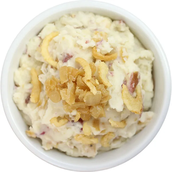 Creamy red skin mashed potatoes topped with crispy fried onions, ready for foodservice distribution and wholesale.